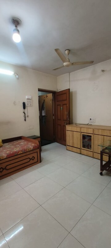 Living Room in 1 BHK Apartment at Lokpuram CHS, Vasant Vihar – for Rent