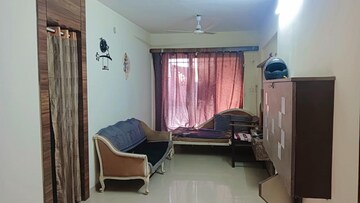 Living Room in 1 BHK Apartment at Lodha Palava Crown, Dombivli East – for Sale