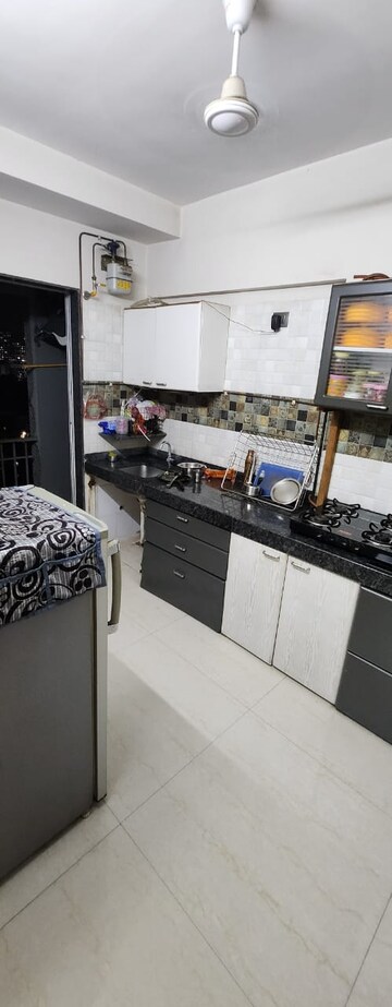 Kitchen in 1 BHK Apartment at Raunak Park View, Ghodbunder Road – for Sale