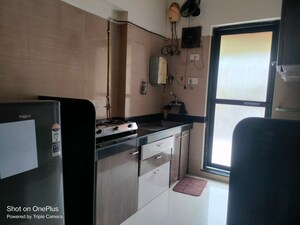Kitchen in 2 BHK Apartment at Raheja Interface Heights, Malad West – for Rent
