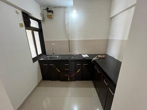 Kitchen in 2 BHK Apartment at Dream Shubhamkaroti CHS, Bhaskar Colony – for Rent