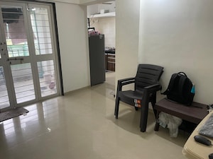 Living Room in 1 BHK Apartment at Siddhi Nisarg, Wakad – for Sale