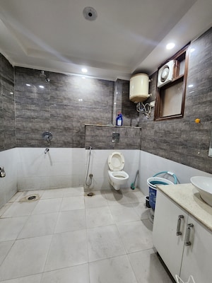 Bathroom in 4 BHK Apartment at Chattarpur – for Rent