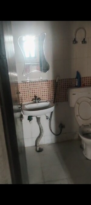 Bathroom in 2 BHK Apartment at Emenox Brave Hearts, Raj Nagar Extension – for Rent