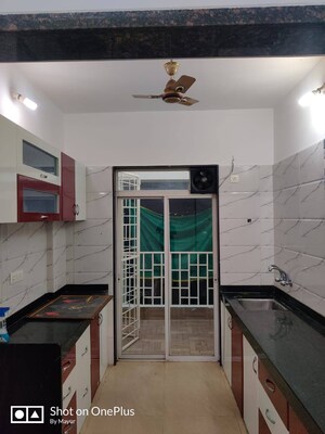 Kitchen in 1 BHK Apartment at Balaji Mesmero, Lohgaon – for Rent