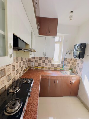 Kitchen in 2 BHK Apartment at Ajnara Integrity, Raj Nagar Extension – for Rent