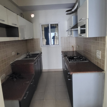 Kitchen in 2.5 BHK Apartment at Mahagun Moderne, Sector 78 – for Rent