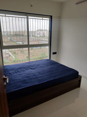 Bedroom in 2 BHK Apartment at Krishna Amorapolis, Dhanori – for Rent