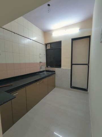 Kitchen in 1 BHK Apartment at Happy Valley, Manpada – for Rent