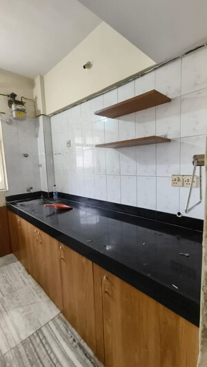 Kitchen in 2 BHK Apartment at Cosmos Heritage, Manpada – for Rent