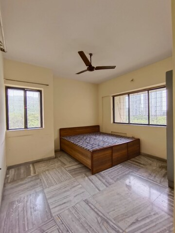 Bedroom in 2 BHK Apartment at Cosmos Heritage, Manpada – for Rent