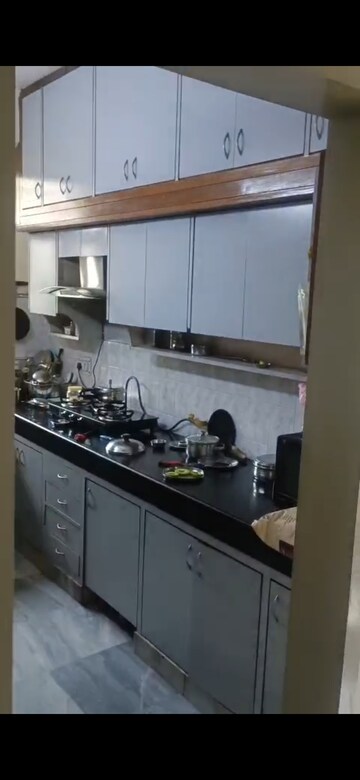 Kitchen in 3 BHK Apartment at Samridhi CGHS Apartments, Sector 21c – for Sale