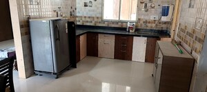 Kitchen in 3 BHK Apartment at Poddar Palm Meadows, Makarba – for Rent