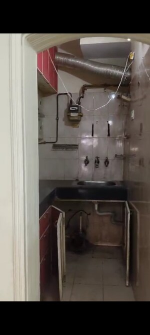 Kitchen in 1 BHK Apartment at Uday Giri Apartments, Sector 34 – for Rent