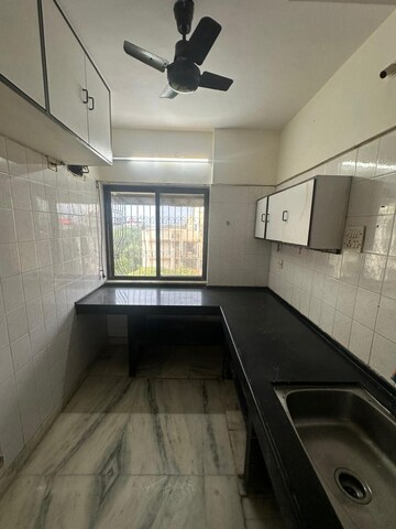 Kitchen in 3 BHK Apartment at Express Apartment, Yari Road – for Rent