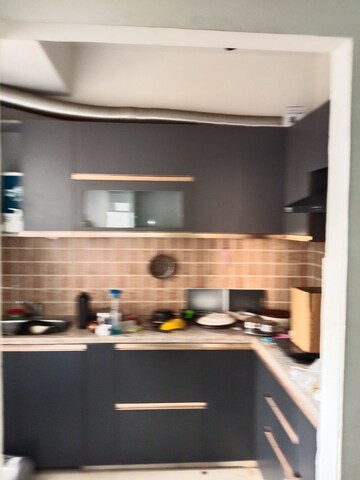 Kitchen in 2 BHK Apartment at Mahagun Mywoods II, Sector 16c Greater Noida – for Rent