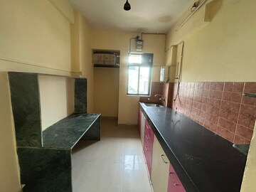 Kitchen in 2 BHK Apartment at Laxmi Plaza, Patlipada – for Rent