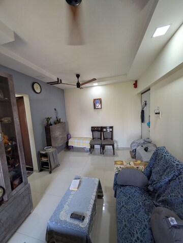 Living Room in 1 BHK Apartment at Raunak Unnathi Woods Phase 7 A And B, Ghodbunder Road – for Sale