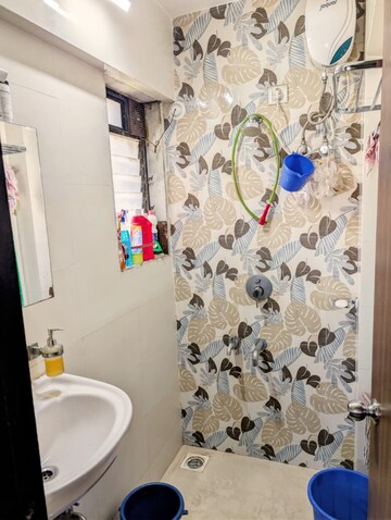 Bathroom in 1 BHK Apartment at Raunak Unnathi Woods Phase 7 A And B, Ghodbunder Road – for Sale