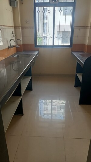 Kitchen in 2 BHK Apartment at Lodha Paradise, Majiwada – for Rent
