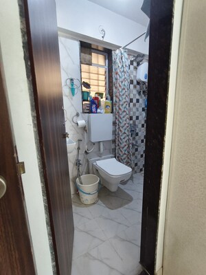 Bathroom in 1 BHK Apartment at Dharti Pressidio, Kandivali West – for Rent