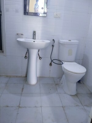 Bathroom in 2.5 BHK Apartment at Aims Golf City, Sector 75 – for Sale