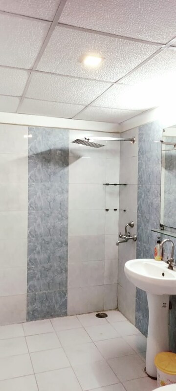 Bathroom in 2.5 BHK Apartment at Aims Golf City, Sector 75 – for Sale