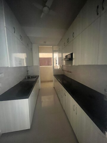 Kitchen in 4 BHK Apartment at Mahagun Moderne, Sector 78 – for Sale