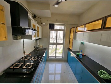 Kitchen in 3 BHK Apartment at Godrej Emerald, Ghodbunder Road – for Rent