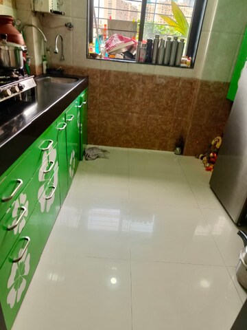 Kitchen in 1 BHK Apartment at Sadguru Garden CHS, Ghodbunder Road – for Sale