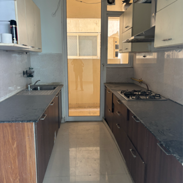 Kitchen in 3 BHK Apartment at Mahagun Mirabella, Sector 79 – for Rent