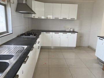 Kitchen in 4 BHK Apartment at Tata Raheja Raisina Residency, Sector 59 – for Sale