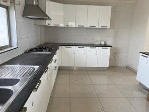 Kitchen in 4 BHK Apartment at Tata Raheja Raisina Residency, Sector 59 – for Sale