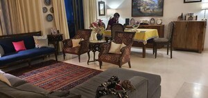 Living Room in 4 BHK Apartment at Tata Raheja Raisina Residency, Sector 59 – for Sale