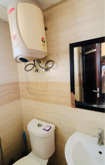 Bathroom in 1 RK Apartment at Supertech Eco Suites, Sector 137 – for Rent