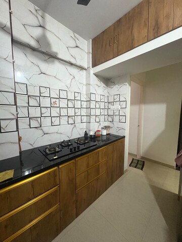 Kitchen in 1 BHK Apartment at Raunak Heights, Ghodbunder Road – for Rent