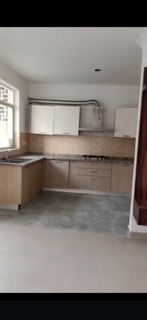 Kitchen in 2 BHK Apartment at Raheja Vedaanta, Sector 108 – for Rent