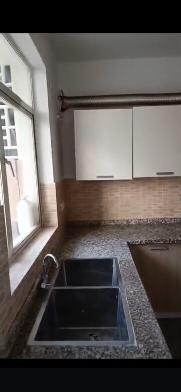 Kitchen in 2 BHK Apartment at Raheja Vedaanta, Sector 108 – for Rent
