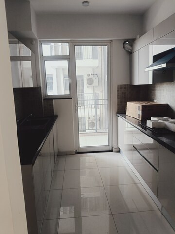 Kitchen in 3 BHK Apartment at Godrej Woods, Sector 43 – for Rent