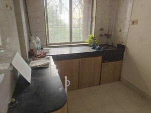 Kitchen in 1 BHK Apartment at Dheeraj Enclave, Borivali East – for Sale
