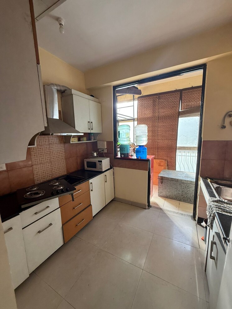 Kitchen, charms-solitaire-ghaziabad 2.5 Bedroom 1550 Sq.Ft. Apartment In Ahinsa Khand 2 Ghaziabad 9438508