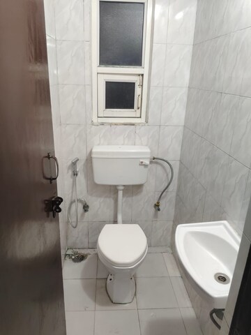 Bathroom in 2 BHK Apartment at Nilaya Greens, Raj Nagar Extension – for Rent