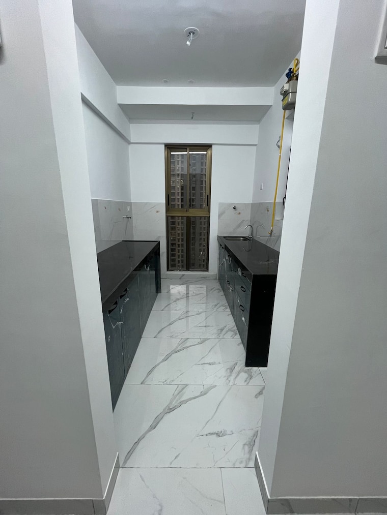 Kitchen, raymond-ten-x-habitat 2 Bedroom 644 Sq.Ft. Apartment In Pokhran Road No Two Thane 9441058