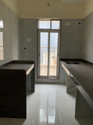 Kitchen in 2 BHK Apartment at Kosmos Kedar Darshan, Borivali West – for Rent