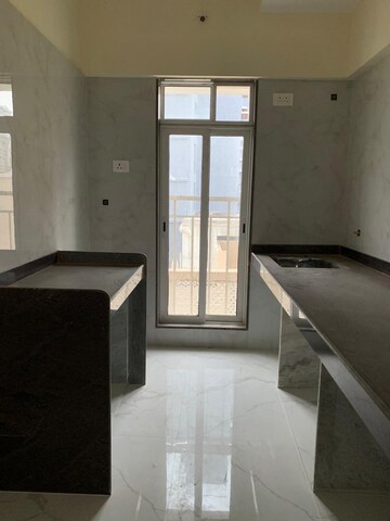 Kitchen in 2 BHK Apartment at Kosmos Kedar Darshan, Borivali West – for Rent