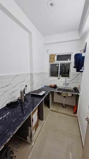 Kitchen in 2 BHK Apartment at Ravi Surya Residency, Gandhi Path – for Sale