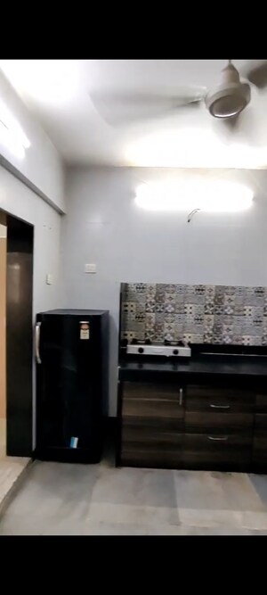 Kitchen in 2 BHK Apartment at Sukumar CHS, Vile Parle East – for Rent