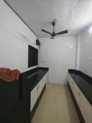 Kitchen in 3 BHK Apartment at Shantiniketan CHS Nerul, Nerul – for Rent