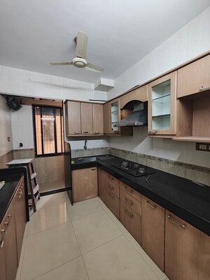 Kitchen in 2 BHK Apartment at Soham Apartments Seawoods, Seawoods – for Rent