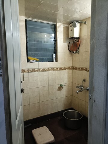 Bathroom in 1 BHK Apartment at Om Krishna CHS, Dahisar East – for Rent